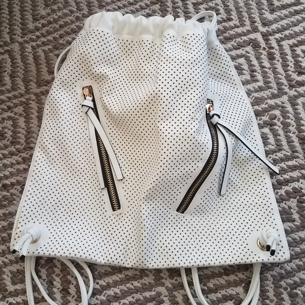 White leather drawstring backpack with cutouts